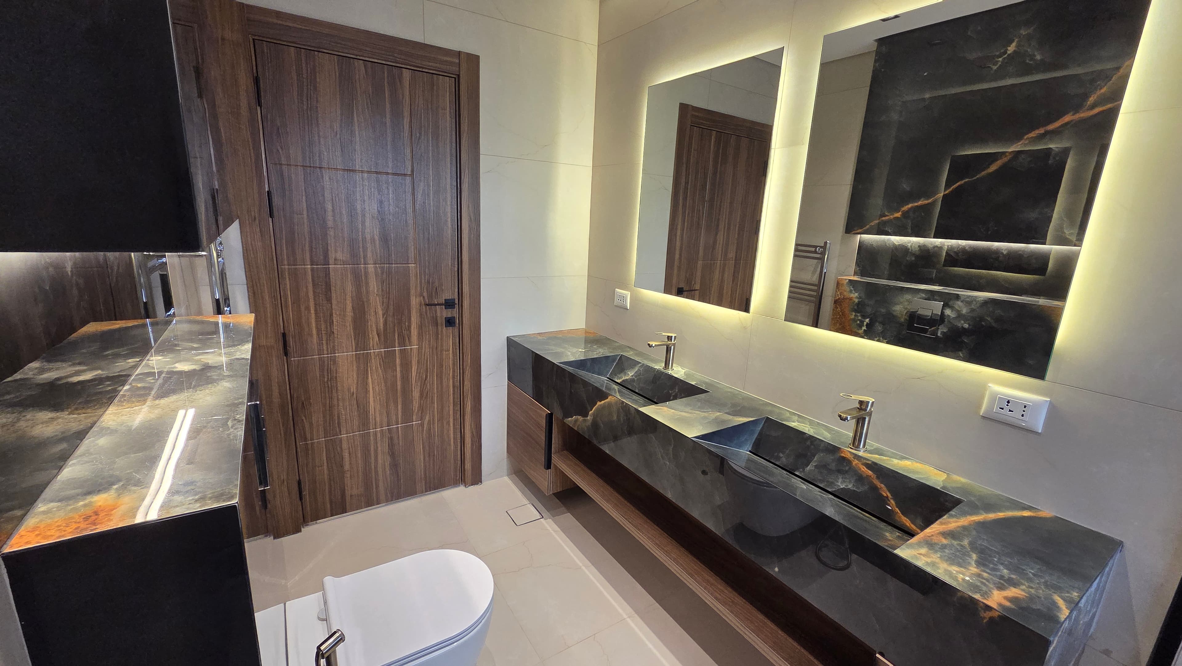 Master bathroom with gold-veined marble
